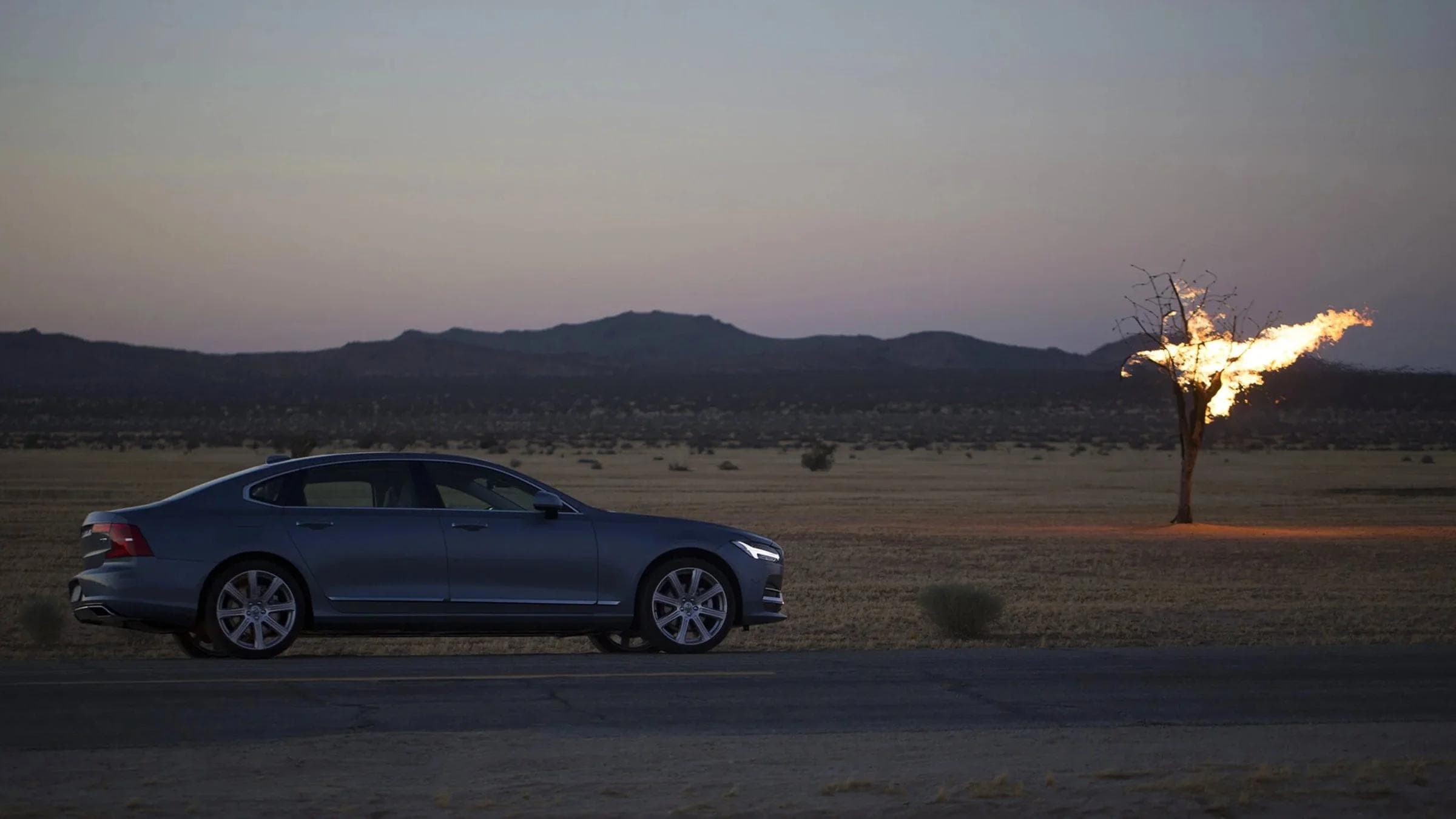 Volvo - Song of the Open Road — Car and landscape without default luxury-car tropes.